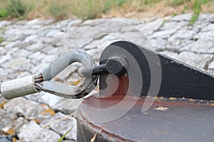 Steel ancher of the entry of the flexible pier to entry the Rotterdam Water Taxi in the Netherlands