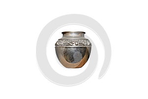 Steel, ancient jug with flower-shaped decorations, isolated on a white background with a clipping path.