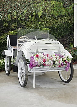 Steel antique car with flower decoration.