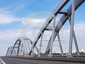 Steel arches of the combined road and railroad bridge