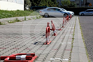 Steel barrier posts in a parking lot in Warsaw