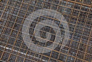 Steel bars reinforcement on construction site, top view, background.