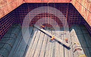 steel billets stacked to loading from a ship in port - the raw material for the manufacture of parts. photo