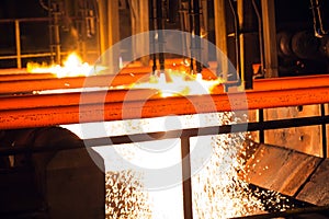 Steel Billets at Torch Cutting. Huge ironworks. photo