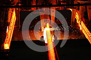 Steel billets at torch cutting in metallurgical plant. Metallurgical production, heavy industry, engineering, steelmaking