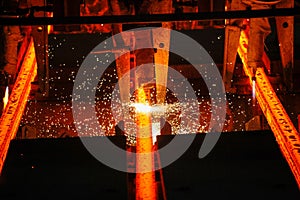 Steel billets at torch cutting in metallurgical plant. Metallurgical production, heavy industry, engineering, steelmaking