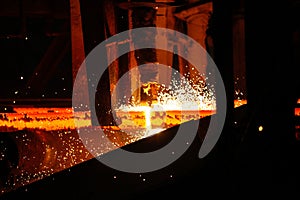 Steel billets at torch cutting in metallurgical plant. Metallurgical production, heavy industry, engineering, steelmaking