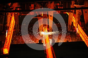 Steel billets at torch cutting in metallurgical plant. Metallurgical production, heavy industry, engineering, steelmaking