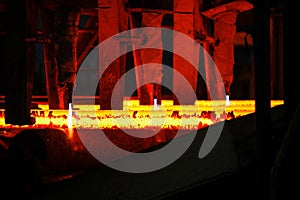 Steel billets at torch cutting in metallurgical plant. Metallurgical production, heavy industry, engineering, steelmaking