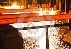 Steel Billets at Torch Cutting. Hot billet bloom continuous casting, also called strand casting photo