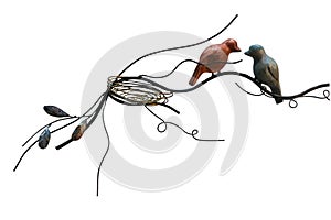 Steel birds and  bird `s nest isolate on white background.Birds made of metal for decoration interior.