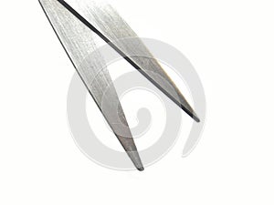 Steel blades of open scissors