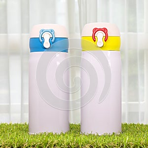 Steel bottle on morning backdrops. Insulated drink container
