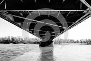 Steel bridge design above the river urbanistic view of achieving humanity photo