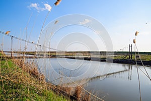 Steel bridge and gas pipeline through irrigation canal