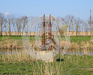 Steel bridge and gas pipeline through irrigation canal