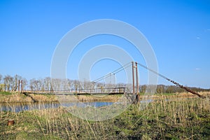 Steel bridge and gas pipeline through irrigation canal