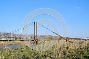 Steel bridge and gas pipeline through irrigation canal