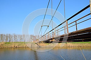 Steel bridge and gas pipeline through irrigation canal