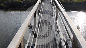 Steel bridge and gas pipeline through irrigation canal.