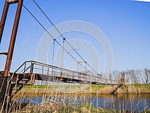 Steel bridge and gas pipeline through irrigation canal