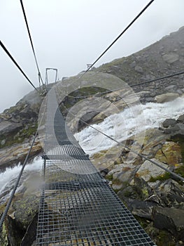 Steel bridge at Olperer hut, Berlin high path, Zillertal Alps in Tyrol, Austria photo