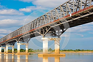 Steel bridge over the Irrawaddy river in Mandalay, Myanmar, Burma. Copy space for text.