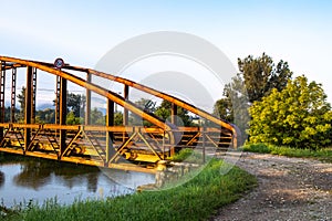 A steel bridge over a water channel