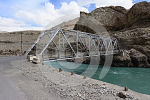 Steel bridge over the Zanksar river Ladakh