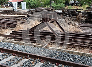 Steel buffers stop in the end of the railway.