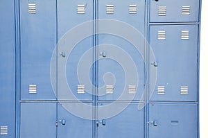 Steel cabinets with several doors painted in blue color with locks in store in Brazil, South America