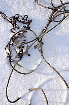 Steel wire rope and chain in snow
