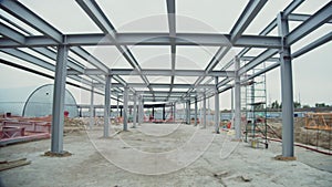 Steel carcass of tunnel hall and hangar at construction site