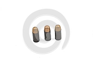 Steel cased, copper jecketed handgun bullets on a white background