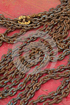 Steel chain at a shipyard in close up.
