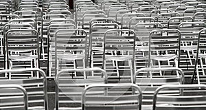 Steel chairs without viewers into an open-air cinema