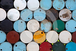 Steel chemical tanks or oil barrels stacked in a row. oil tanks background and energy industry concept