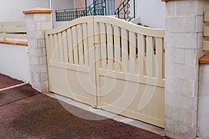 Steel classic beige sand metal gate fence of house street view