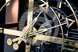 Steel clock detail, side view, hands wide