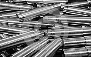 steel cnc-turned raw surface pipes closeup industrial background