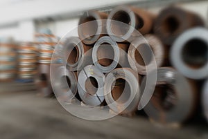Steel coils stacked in a warehouse