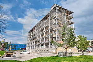 steel construction of future office building and construction equipment