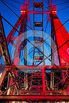 steel construction of red historic ferris wheel Wienner Riesenrad in Prater theme park Vienna, Austria