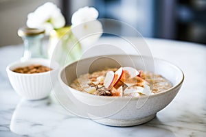 steel-cut oatmeal with cinnamon, apples, and a dollop of cream