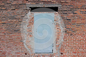 Steel door in the brick wall