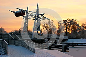 Steel drawbridge with snow cover on a canal in northern of Germany