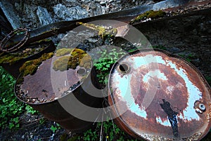 Steel drums polluting nature photo