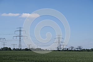 Steel electrical pylons in a rural landscape