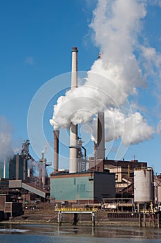 Steel factory with big chimneys in the Netherlands