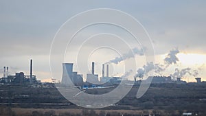 Steel factory with smoking furnaces